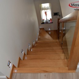 Oak stairs with glass balustrade 