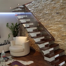 Wooden stairs with glass balustrade